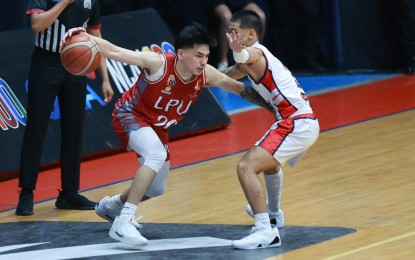 <p><strong>PIRATES WIN. </strong>Lyceum of the Philippines University's Renz Villegas (No. 20) tries to get past Letran's James Miller (No. 2) during the National Collegiate Athletic Association (NCAA) Season 100 men's basketball tournament at the Filoil EcoOil Arena in San Juan on Friday (Oct. 11, 2024). Villegas scored 23 points as the Pirates won the game, 91-68. <em>(NCAA photo) </em></p>