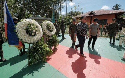 <p><strong>‘PROTECT PEACE AT ALL COSTS.’</strong> Office of the Presidential Adviser on Peace, Reconciliation and Unity (OPAPRU) Secretary Carlito Galvez Jr. joins the wreath-laying rites in commemoration of the Patikul Massacre in Sulu province on Thursday (Oct. 10, 2024). Galvez maintained that the government is determined to protect the gains of the peace process. <em>(Photo courtesy of OPAPRU)</em></p>