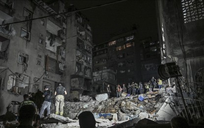 <p><strong>CARNAGE.</strong> Lebanese civil defense and emergency teams conduct a search and rescue operation following the Israeli airstrike on the Nowayri area of Beirut, the capital of Lebanon, on Oct. 10, 2024. A building targeted in the attack was destroyed while initial reports said at least 22 people were killed and 117 others were injured. <em>(Anadolu)</em></p>