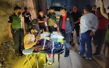 <p><strong>BUY-BUST.</strong> Cebu City Mayor Raymond Alvin Garcia (center, in red shirt) witnesses the on-site inventory of the suspected shabu seized from a jobless woman in an anti-drug sting in Barangay Carreta on Friday (Oct. 11, 2024). Philippine Drug Enforcement-Central Visayas spokesperson Leia Alcantara said the suspect yielded PHP34 million worth of shabu. <em>(Photo courtesy of PDEA-7)</em></p>