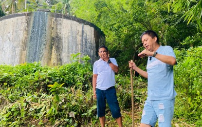 <p><strong>WATER PROJECT</strong>. Barangay Buenavista, Legazpi City chief Rogelio A. Leron (left) and former Ako Bicol (AKB) Party-list Representative Christopher Co during a visit to a water collector and reservoir that supplies the residents of the village on Monday (Oct. 14, 2024). Co said there is a need for additional pipelines, water filtration, and reservoirs to ensure the expansion of the project.<em> (PNA photo by Connie Calipay)</em></p>