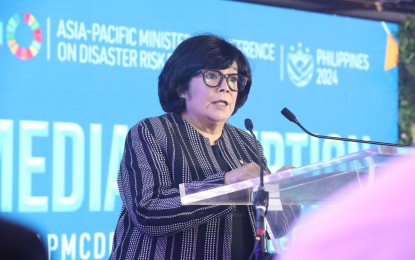 <p><strong>CALL TO ACTION.</strong>  Environment Secretary Maria Antonia Yulo-Loyzaga addresses the delegates of the Asia Pacific Ministerial Conference on Disaster Risk Reduction (APMCDRR) during the opening on Monday (Oct. 14, 2024) at the Philippine International Convention Center in Pasay City.  Loyzaga urged for the improvement of localized disaster risk management.<em> (Contributed photo)</em></p>