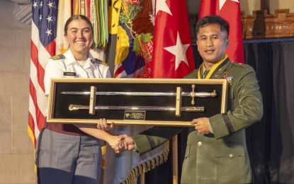 <p><strong>PRESTIGIOUS AWARD.</strong> Philippine Army Maj. Floren P. Herrera (right) accepts the Alexander R. Nininger Award for Valor at Arms during a ceremony at the Cadet Mess Hall of West Point, New York on Oct. 10, 2024. For the first time in its 19-year history, the Alexander R. Nininger Award was presented to a US Military Academy international graduate.<em> (Photo courtesy of Christopher Hennen/USMA PAO/VI)</em></p>