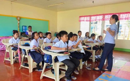 <p><strong>LIGHTER TASKS</strong>. A teacher and her learners in Naval, Biliran in this undated photo. At least 2,778 non-teaching personnel have been hired by the government as part of its effort to remove additional paper work from public school teachers, the Department of Education (DepEd) regional office in Eastern Visayas reported Tuesday (Oct. 15, 2024). <em>(Photo courtesy of Department of Education) </em></p>