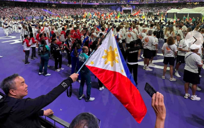 <p><strong>TEMPLATE OF SUCCESS.</strong> Philippine Olympic Committee (POC) president Abraham “Bambol” Tolentino waves the national flag during the closing ceremony of the Paris Olympics on Aug. 11, 2024. Tolentino on Thursday (Dec. 19) said the template of success used by two-gold medal haul of gymnast Carlos Yulo and the two bronzes from boxers Nesthy Petecio and Aira Villegas at the 2024 Olympics, as well as Tokyo 2020 weightlifting gold medalist Hidilyn Diaz-Naranjo would be enhanced to maintain the upward trajectory of Philippine sports. <em>(Contributed photo)</em></p>