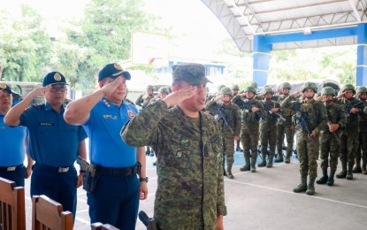 SECURING THE POLLS. The Nueva Ecija police formally receive military reinforcements during a ceremony at the Provincial Police Office on May 3, 2025. The deployment aims to bolster security and ensure swift response to any election-related incidents.