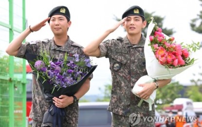 RM (left) and V, members of K-pop megagroup BTS