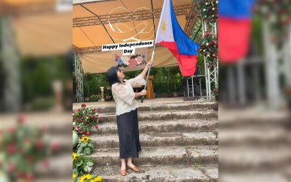 PROUD TO BE FILIPINO. Mary Jehn Fluhr, who has lived in Germany for 29 proudly waves the Philippine flag during the celebration of the Philippine Independence Day in Germany in 2024.