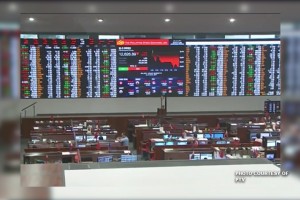 Peso stays afloat, local shares down on trade concerns 
