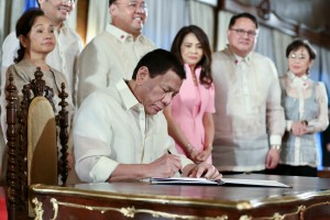 Duterte signs law modifying PNP rank