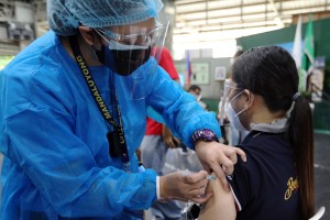 More Filipinos urged to get Covid-19 vaccines during ECQ