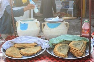 Impoverished Afghans plead for bread in front of bakeries