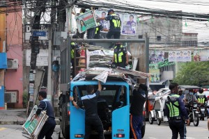 Manila, QC start removing election campaign materials