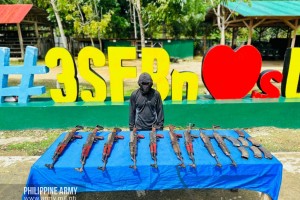 NPA leader yields in Surigao Sur, hands over 9 firearms 