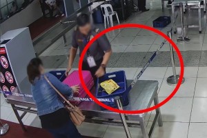 NAIA screener axed for getting chocolates from passenger’s luggage