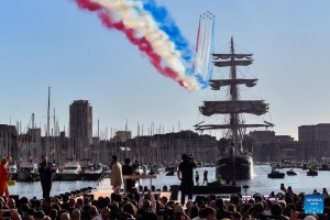 Olympic flame lands at Marseille Old Port amid fiery atmosphere