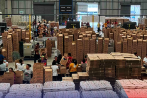 Volunteers help DSWD produce 344K food packs for typhoon victims