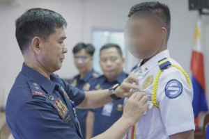 PNP fetes brave Makati guard for fighting off 5 robbers