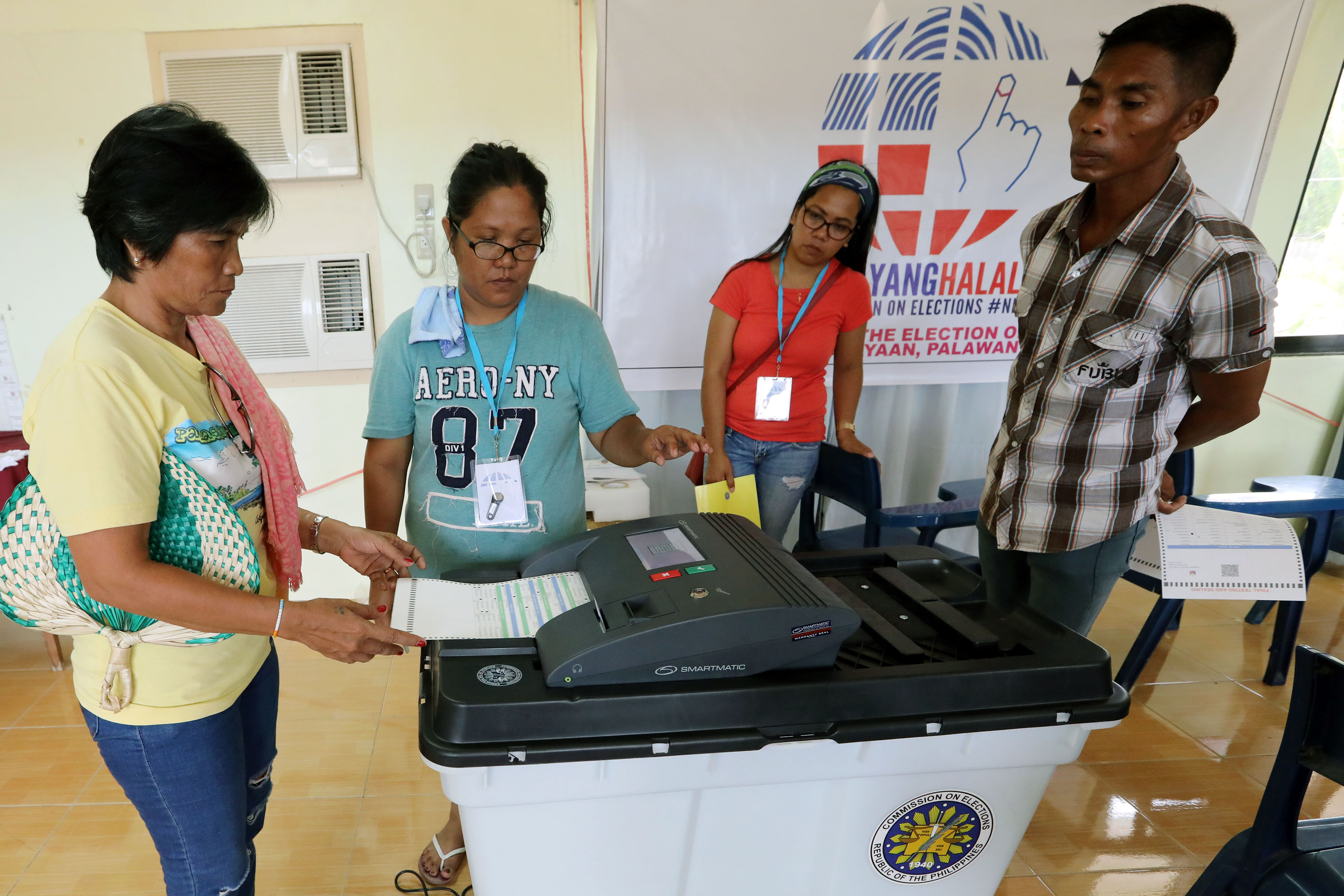 Vote-Counting Machine (VCM) testing and sealing | Photos | Philippine ...