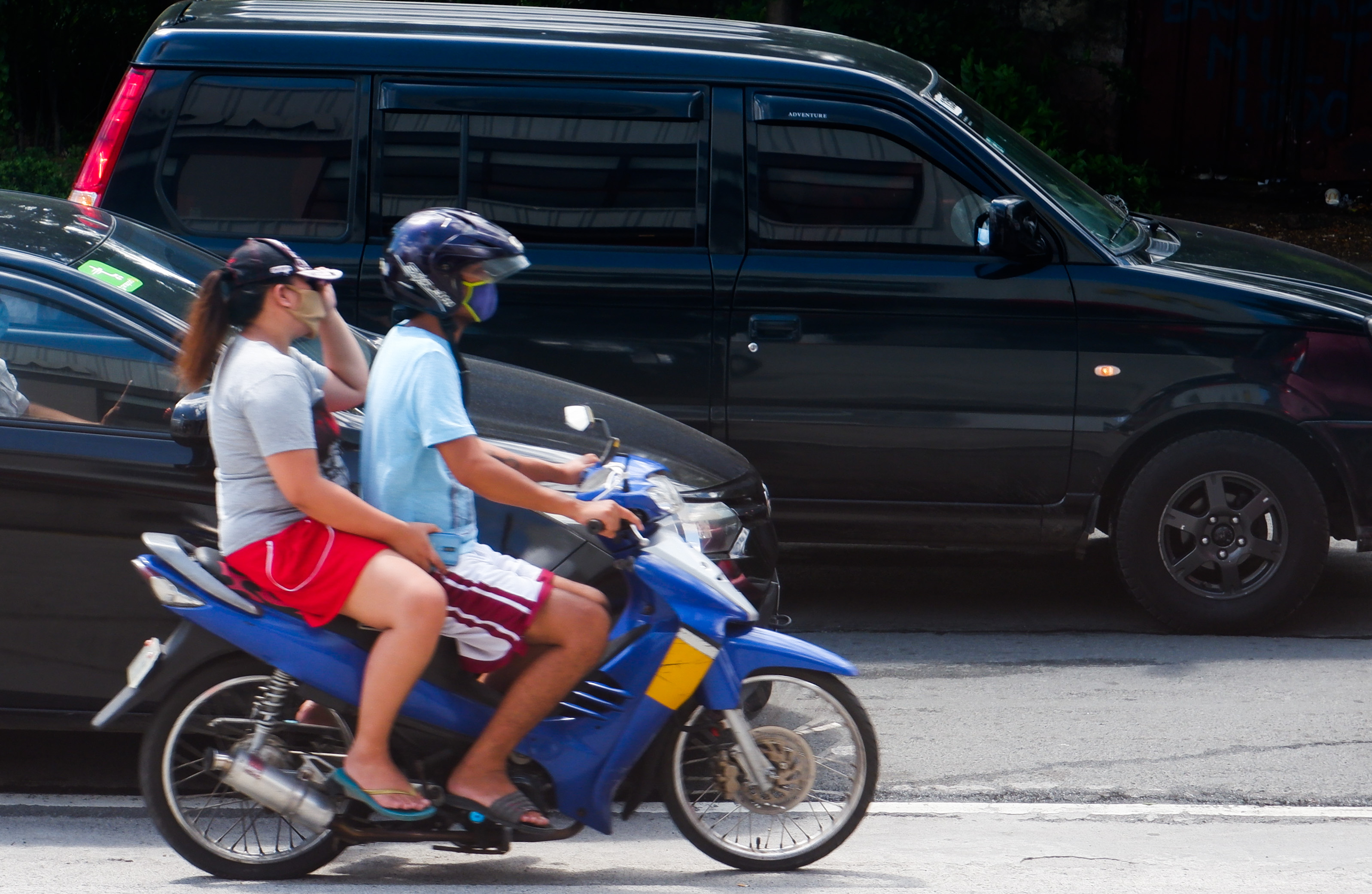 riding pillion on a motorcycle