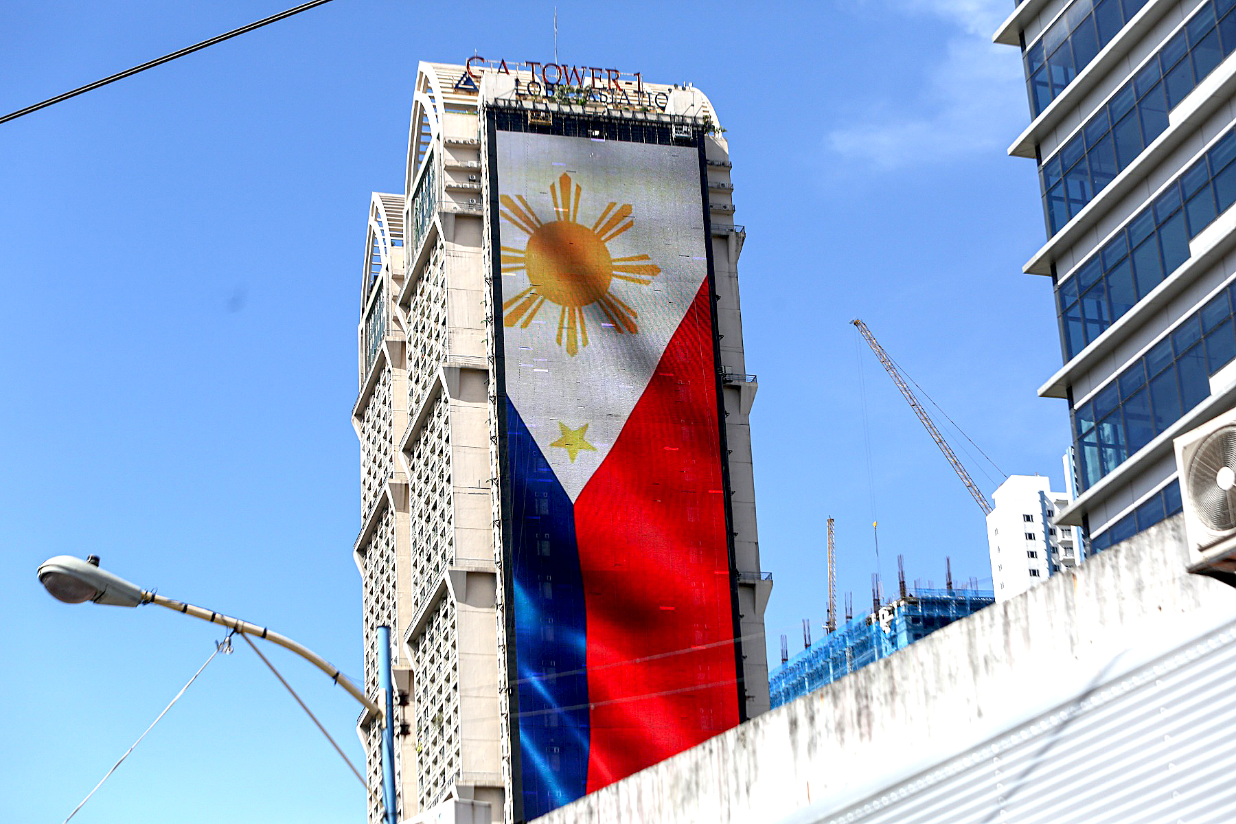PHILIPPINE FLAG FROM A BUILDING Photos Philippine News Agency